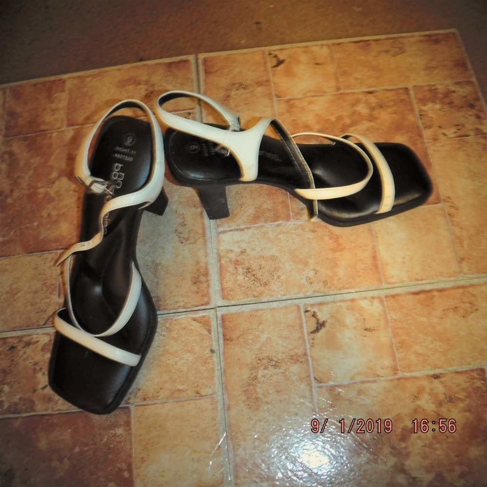 White strappy heel with black sole.